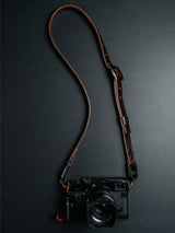 Lavietnamita leather camera strap adjustable in dark brown clour double snap rivets hanging on camera