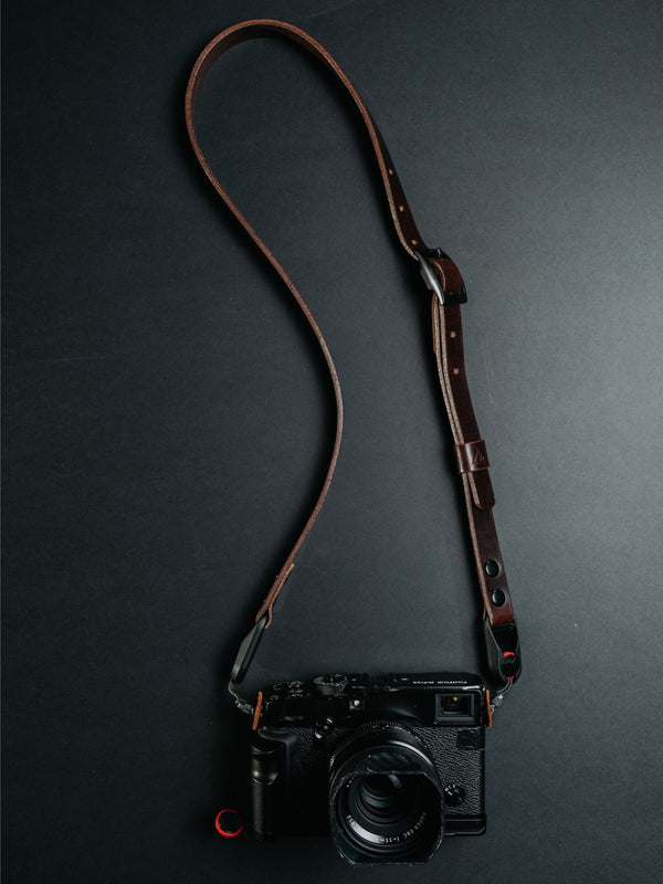 Lavietnamita leather camera strap adjustable in dark brown clour double snap rivets hanging on camera