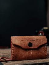 Lavietnamita handmade leather  wallet sd card key ring standing on wooden table brown colour close with snap button